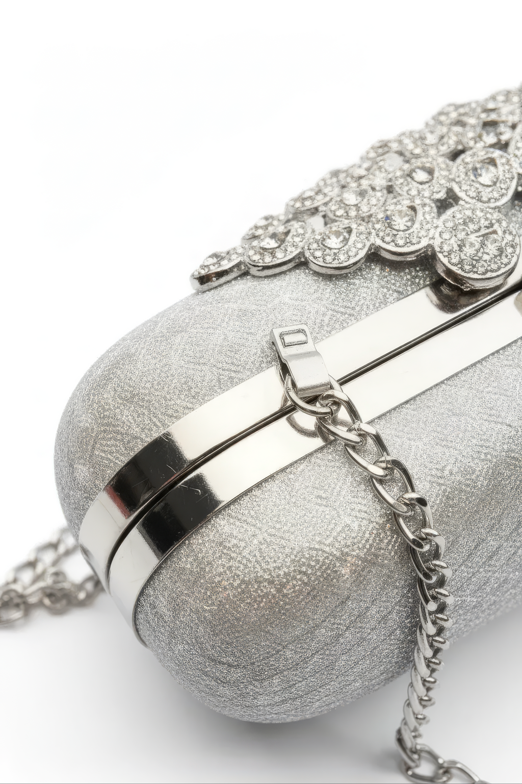 A close-up of the Pearl Chain Handbag featuring a metallic chain shoulder strap and decorative rhinestones on top, set against a white background.