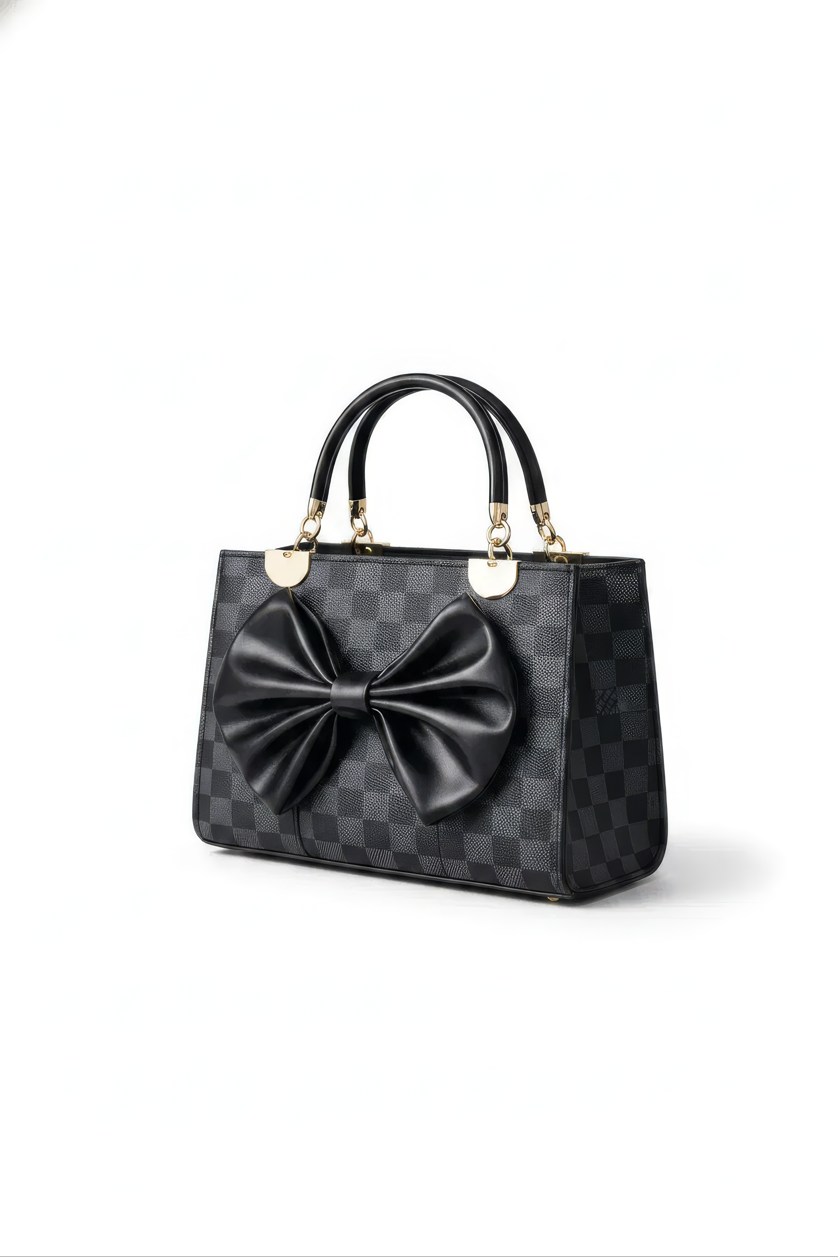 The Nocturne Bow Handbag is a black leather bag featuring a checkered design, gold hardware, two top handles, and a large black leather bow on the front, all showcased against a plain white background.